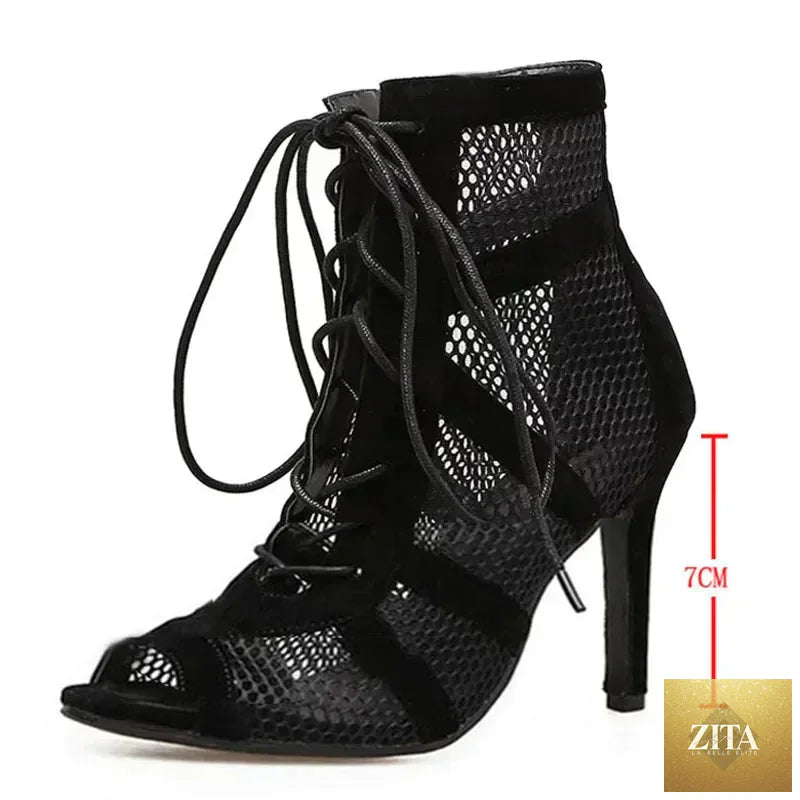 Black lace-up women's dance sandals with open toe, ankle strap, thin heels, and hollow-out design for stylish comfort.