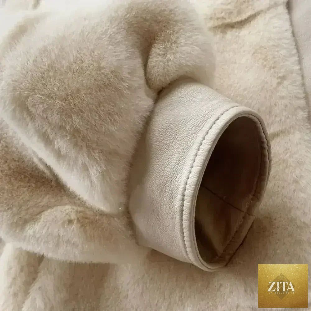 White faux fur jacket with vegan leather trimmed cuffs by Zita La Belle Elite, featuring a cozy, luxurious design in size S to XXL.