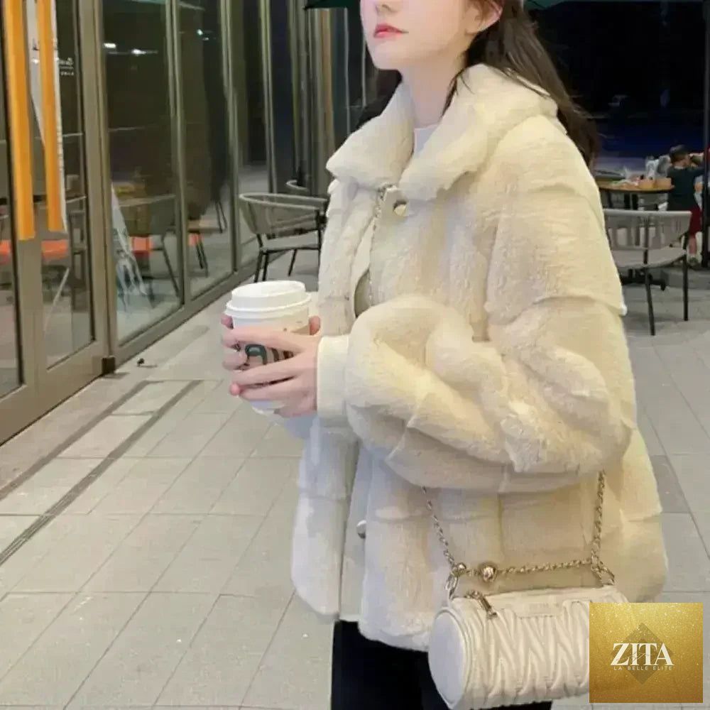 White faux fur jacket with vegan leather trimmed cuffs from Zita La Belle Elite, shown on a model, size S to XXL.