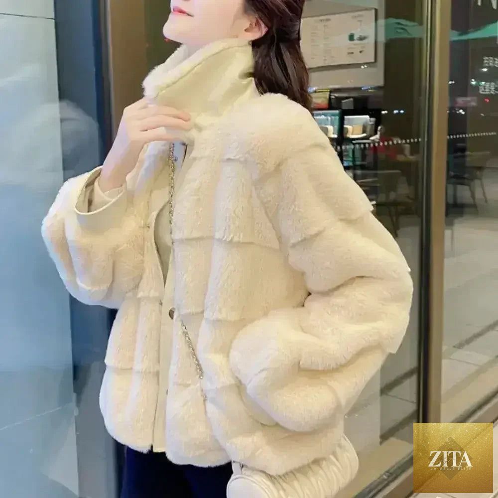 White faux fur jacket by Zita La Belle Elite with vegan leather trimmed cuffs, available in sizes S to XXL.