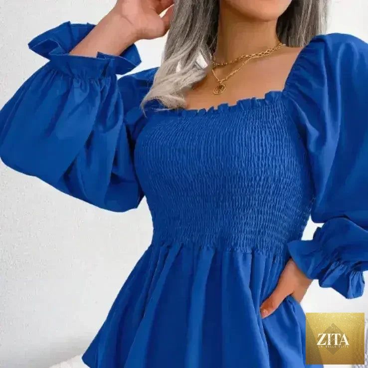 Femstylo loose fit chiffon blouse, elegant polyester top with flowing fabric, perfect for stylish casual or formal wear.