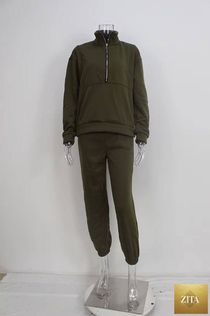 Women's full-zip cropped sweatshirt and wide-leg fleece pants two-piece set by MERIDGE, shown in a casual indoor setting.