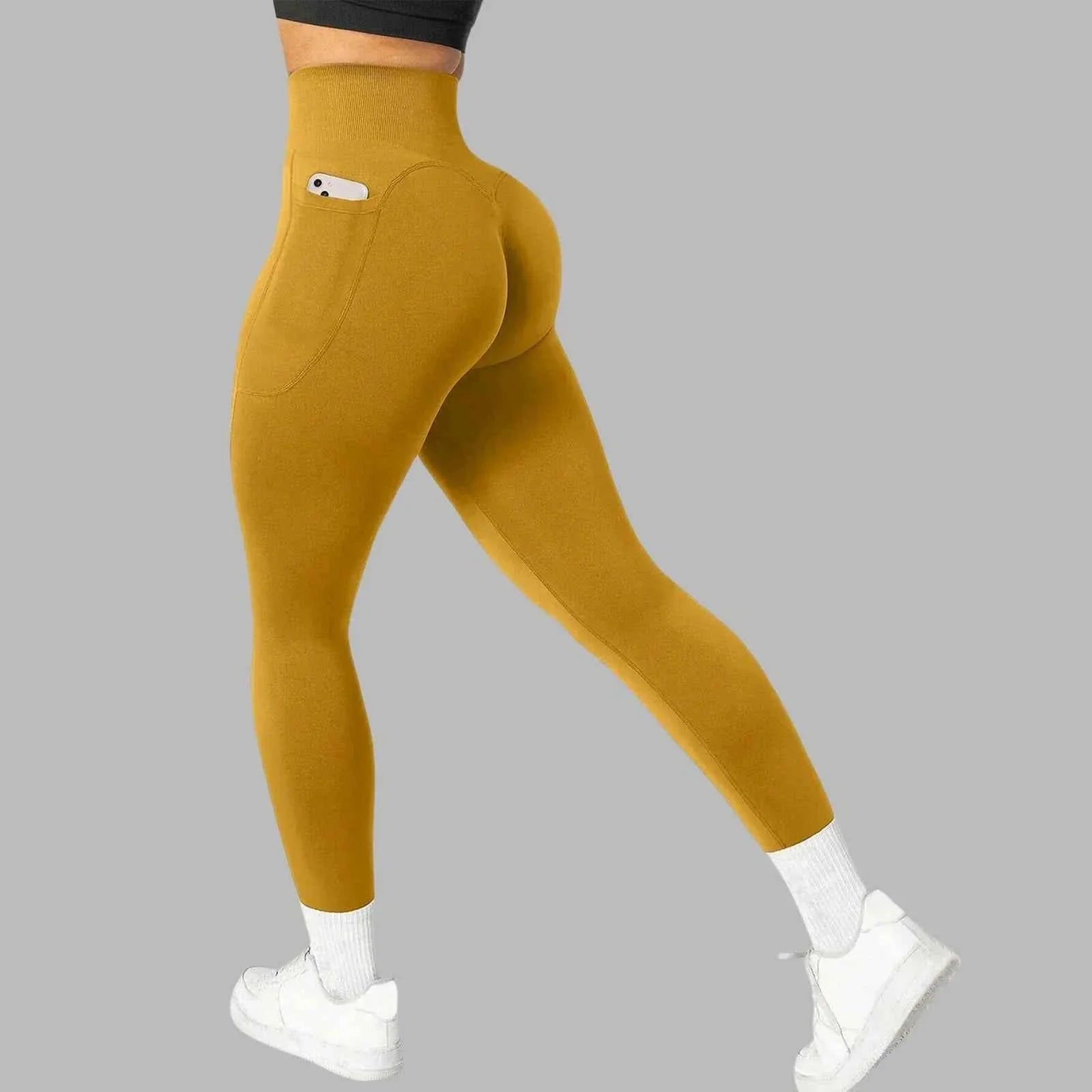 Women's seamless pocket yoga leggings by THRIXINE, showing a close-up of the soft, stretchy fabric with integrated side pockets.