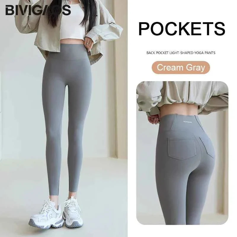 White women's Sharkskin leggings by THRIXINE, featuring a sleek, smooth fabric and a comfortable fit.