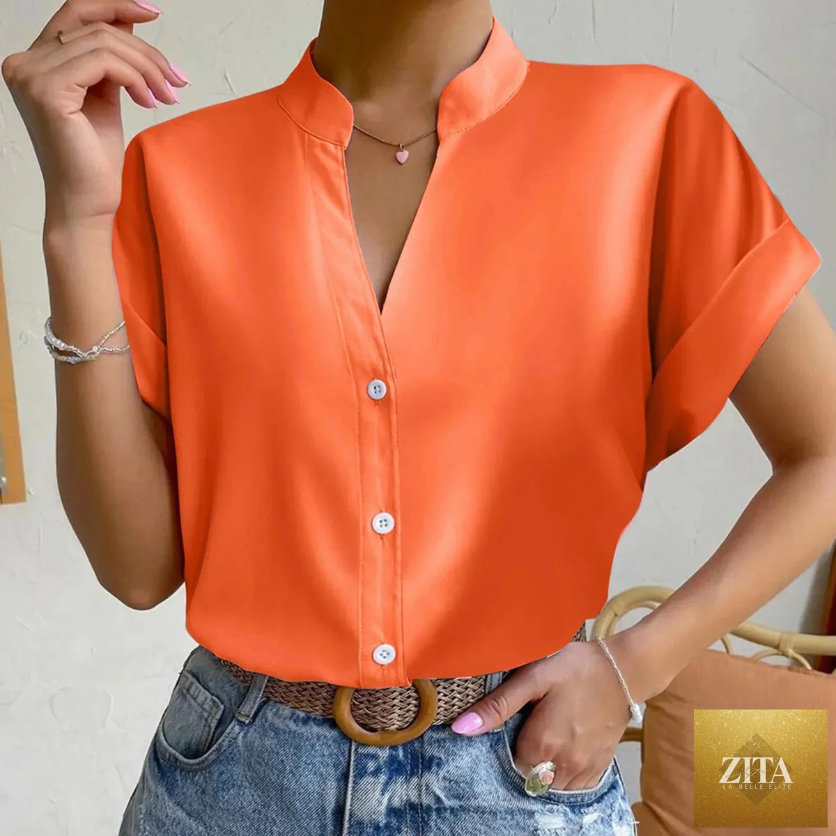 Light orange satin V-neck short sleeve shirt for women by FitiqueFit, casualwear with an elegant, relaxed fit.