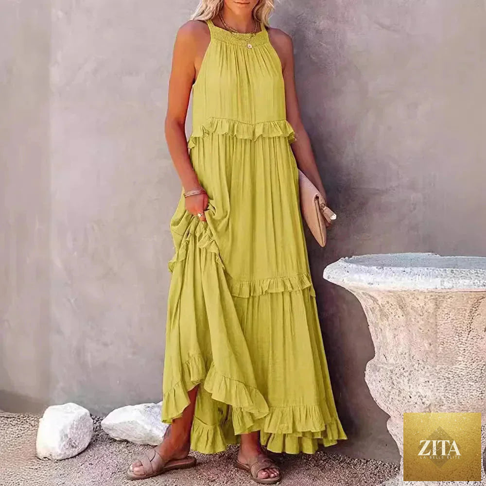 Elegant apricot ruffle maxi dress by Zita La Belle Elite, showcasing flowing fabric and stylish casualwear design.