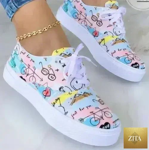 Women's 2022 Graffiti Sneakers by Femstylo featuring vibrant urban graffiti design and comfortable athletic footwear.