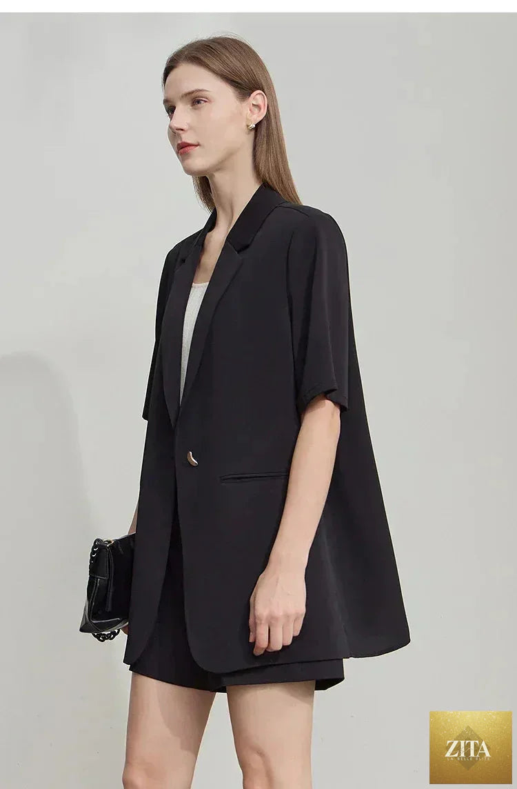 Femstylo Amii Women's minimalist short sleeve blazer with notched lapel, contrast patchwork, and one button closure.