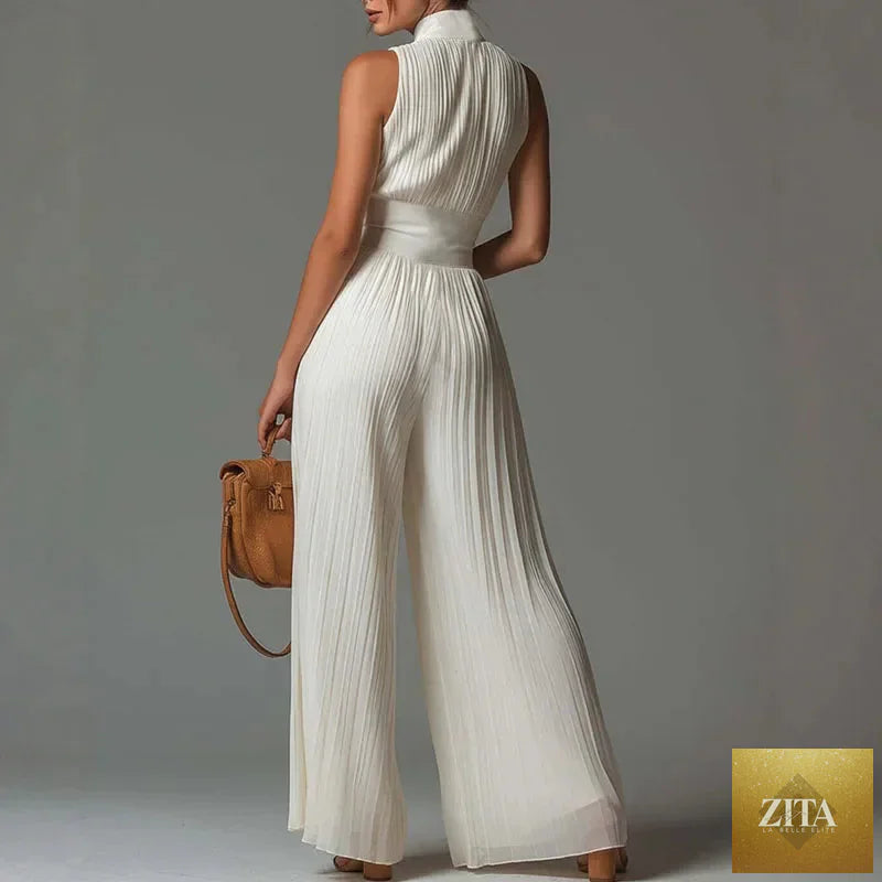 Elegant women's spring jumpsuit by Selvanelle featuring a stand collar, zipper, pleated design, high waist, wide legs, and sleeveless style.