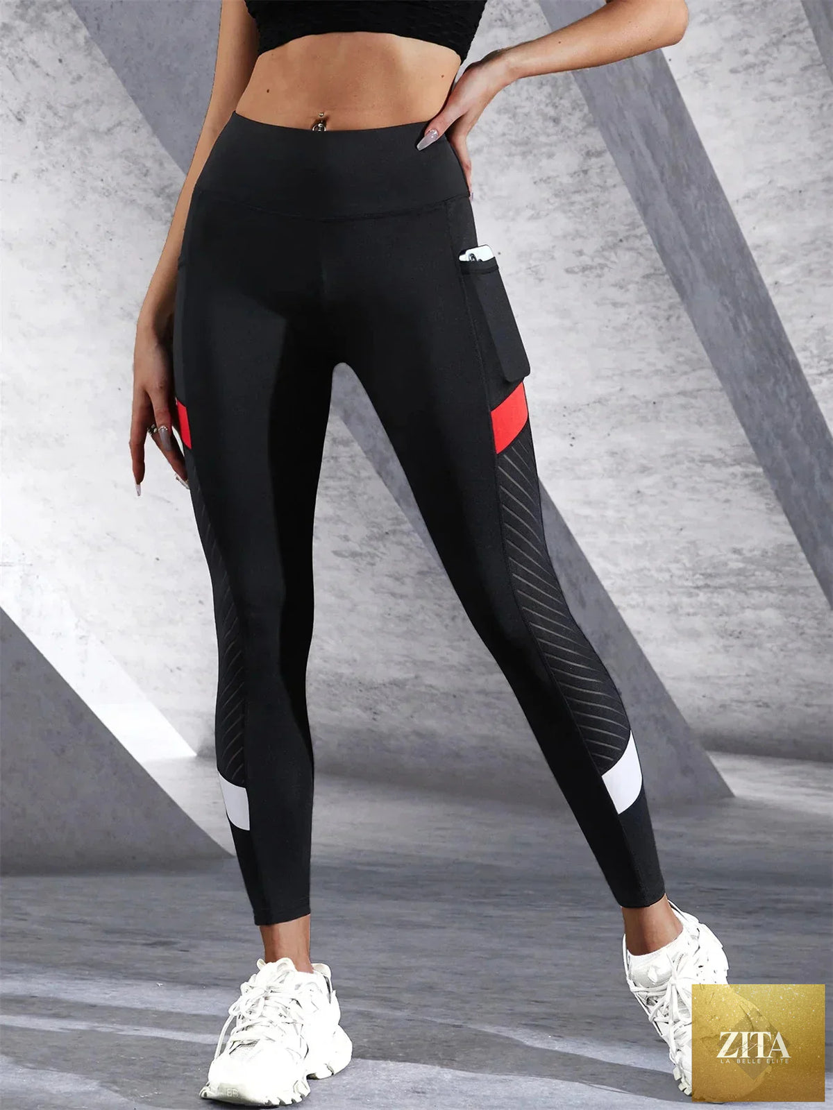 Black colorblocked mesh high-waist yoga leggings with side pockets from FitiqueFit activewear, designed for comfort and style.
