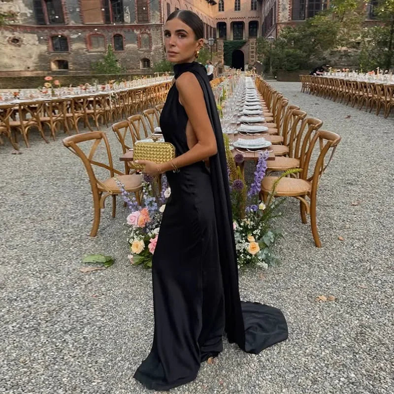 Femstylo backless lace-up maxi dress, sleeveless evening gown with ribbon details, perfect for elegant parties.