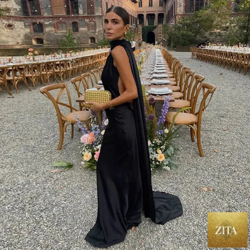 Femstylo backless lace-up maxi dress, sleeveless evening gown with ribbon details, perfect for elegant parties.
