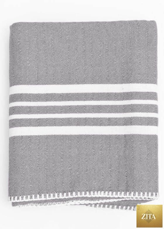 Gray Turkish towel from Zita La Belle Elite, farm house style without fringe, showcasing soft, lightweight, textured fabric.