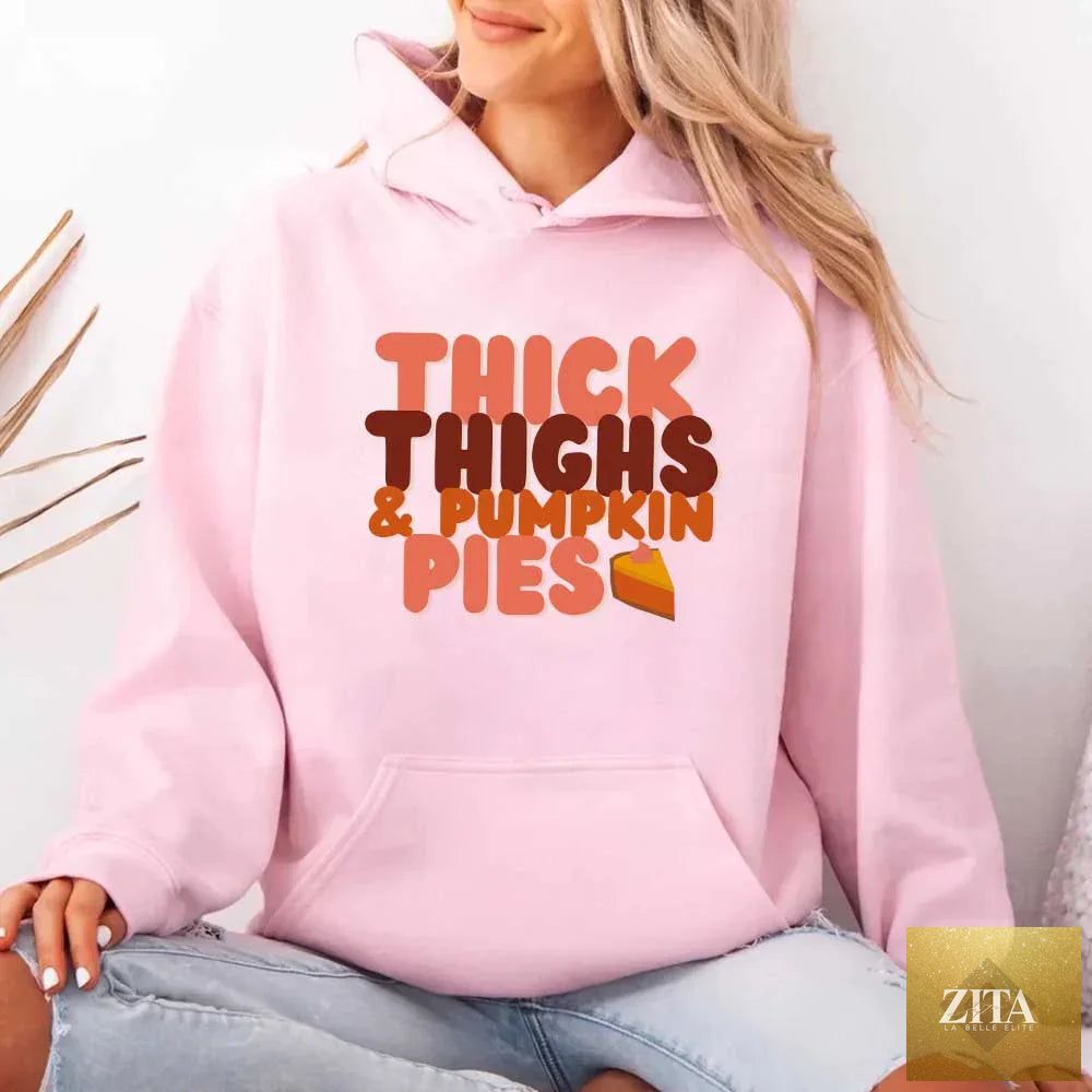 Pink fleece hoodie with "Thick Thighs and Pumpkin Pies Fall Vibes" graphic, featuring a cozy fall-themed design by Adorb Custom Tees.