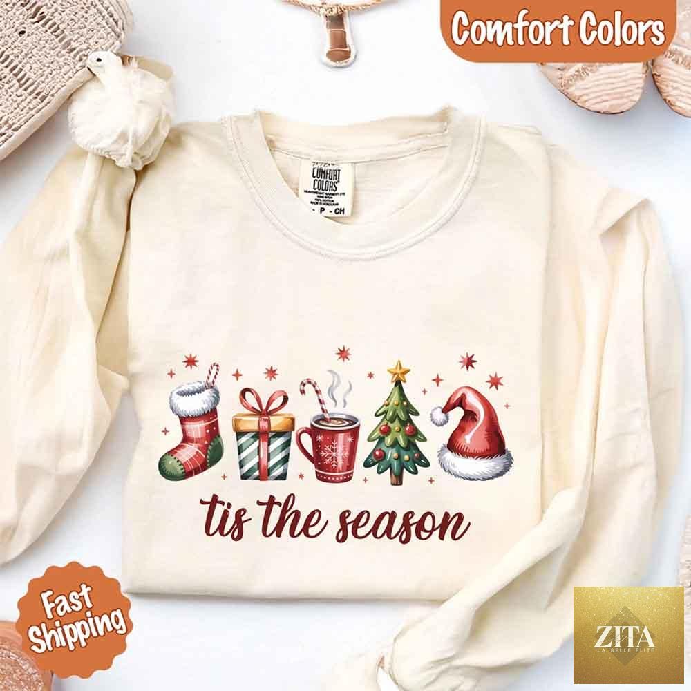 Comfort Colors long sleeve Christmas shirt with "Tis The Season" design by Adorb Custom Tees, featuring festive holiday graphics.