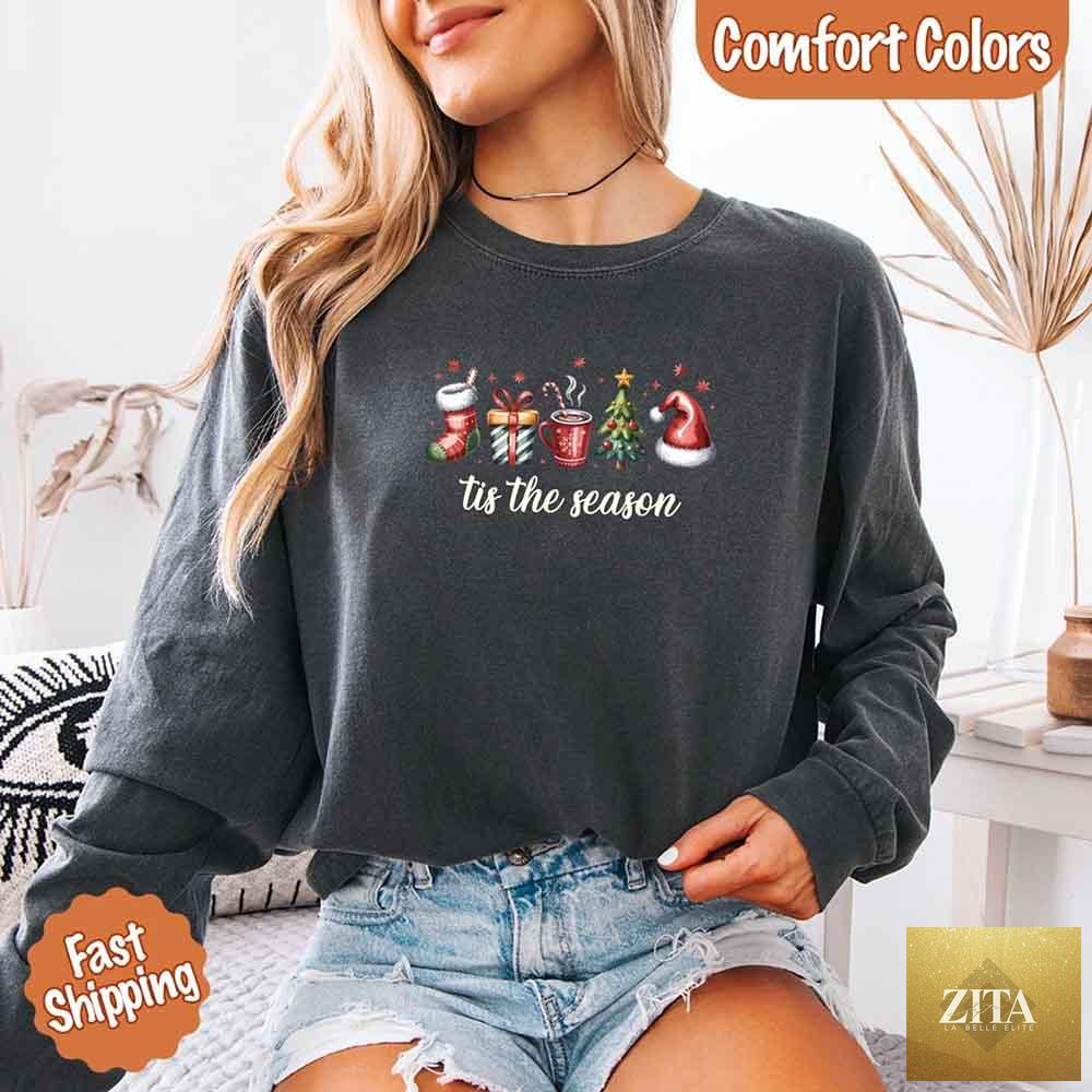 Comfort Colors long sleeve Christmas shirt with "Tis The Season" design by Adorb Custom Tees, featuring festive holiday graphics.