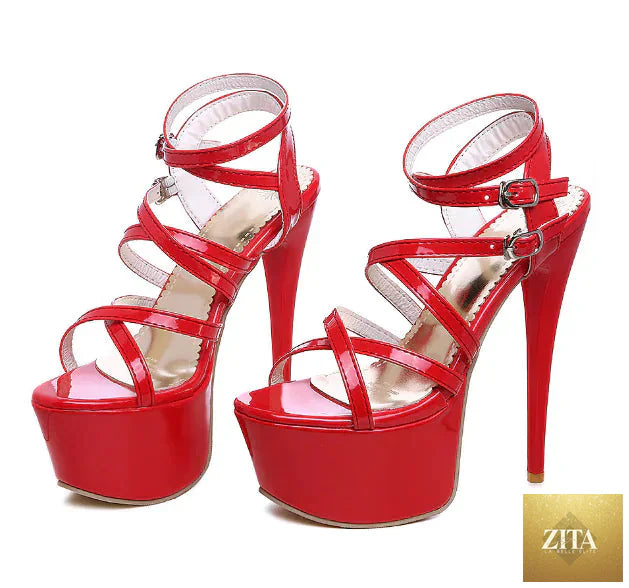 Elegant black strappy high heels with stiletto heels for women, featuring sleek design and stylish ankle straps.