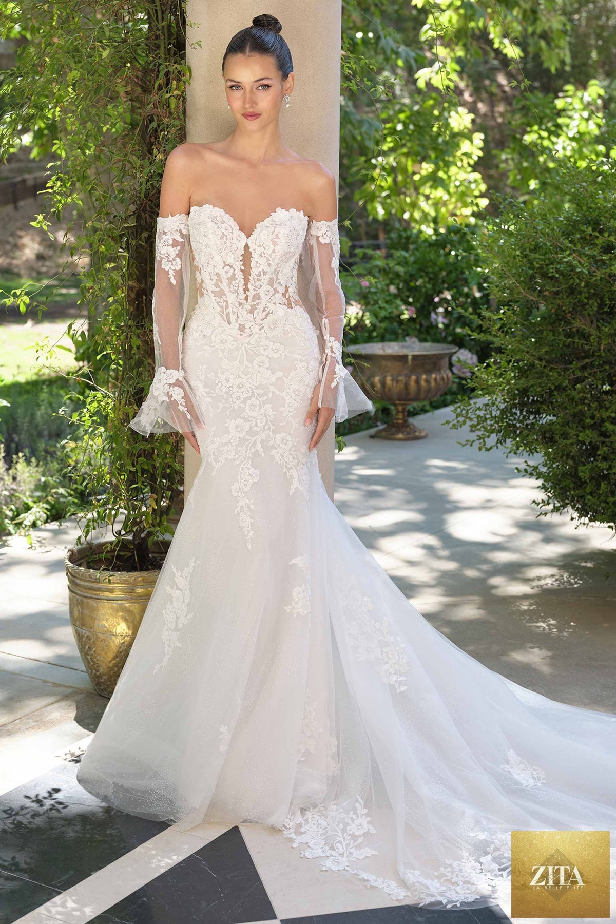 Off-white Andrea & Leo WL065 mermaid bridal gown with removable sheer lace sleeves and elegant fit for wedding attire.