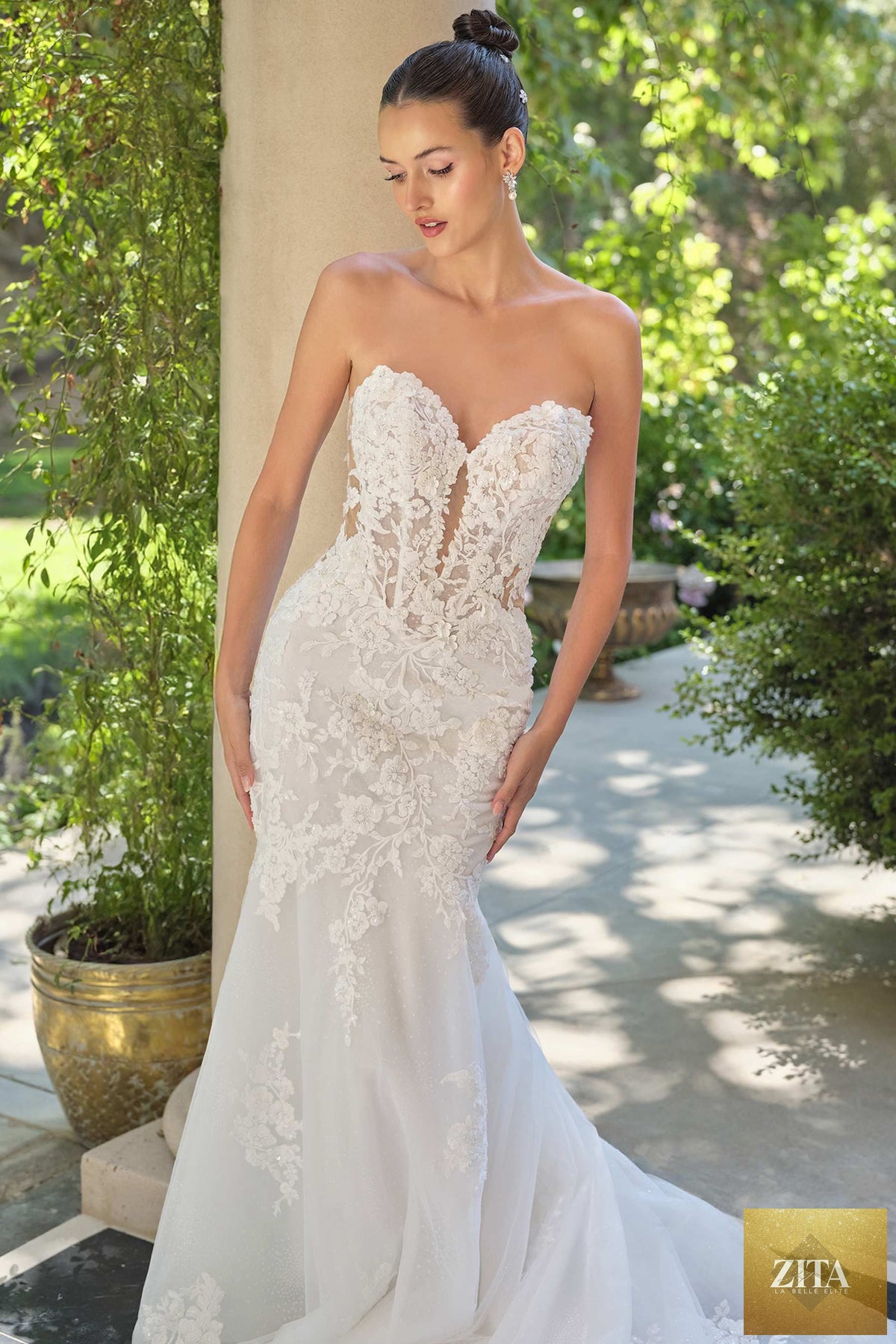 Off-white Andrea & Leo WL065 mermaid bridal gown with removable sheer lace sleeves and intricate lace detailing.