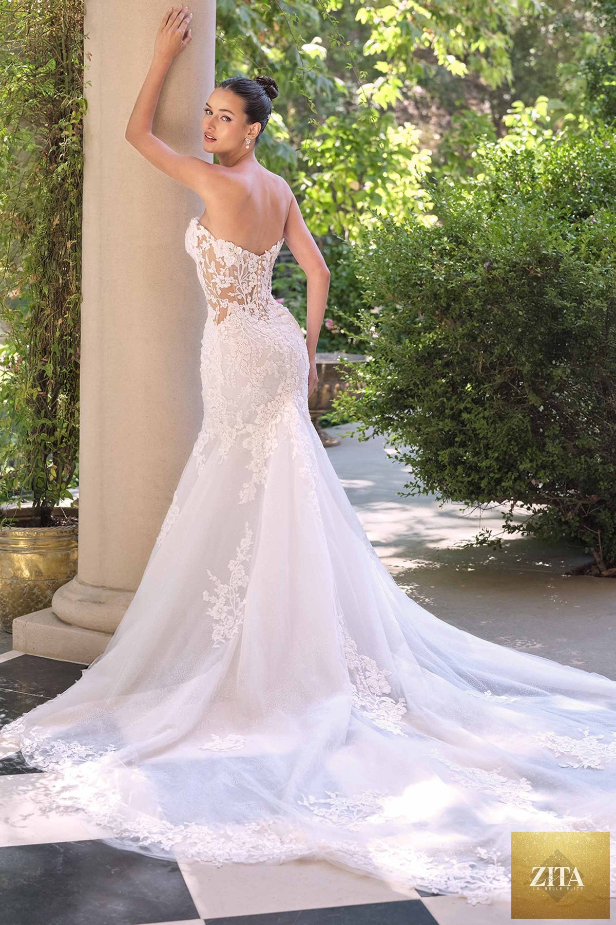 White Andrea & Leo WL065 mermaid bridal gown with removable sheer lace sleeves, showcasing elegant back design.