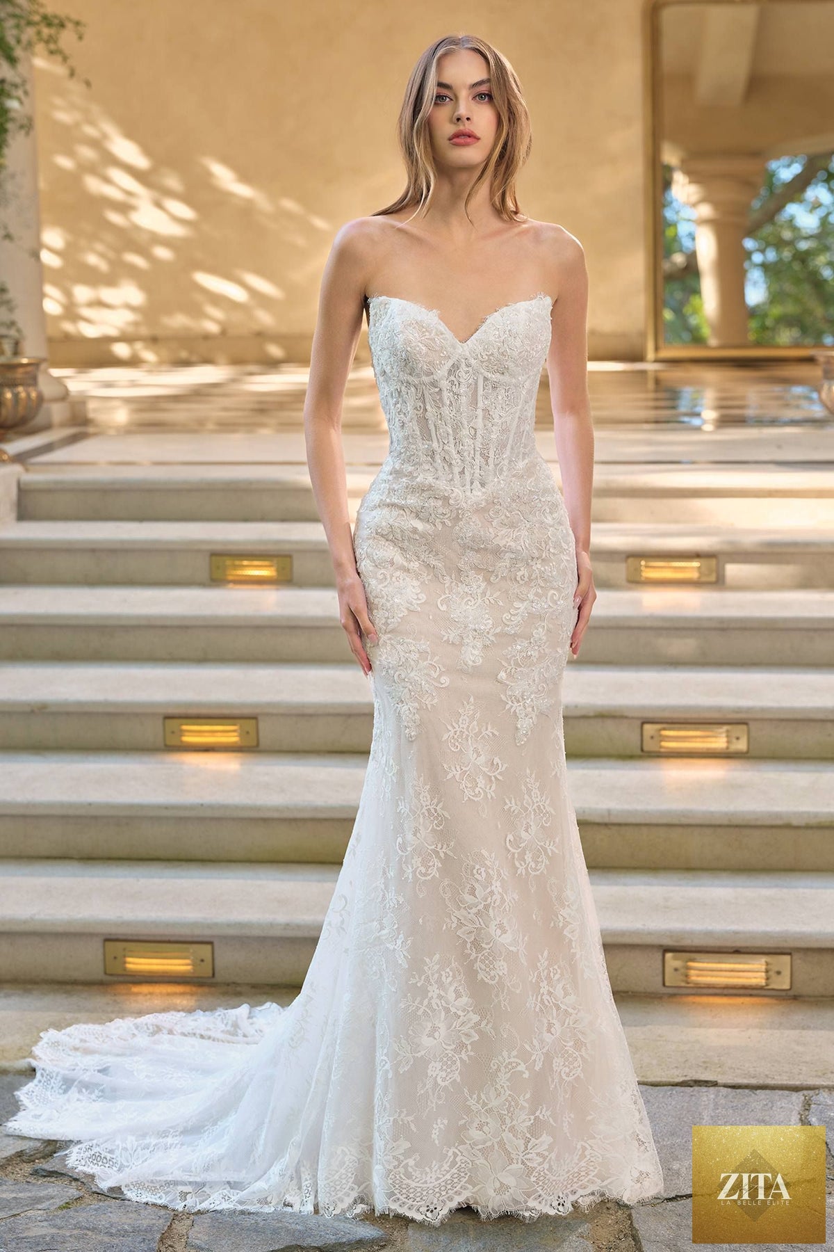 Elegant white and nude fit and flare lace wedding dress with matching bolero jacket from Andrea & Leo WL071 collection.