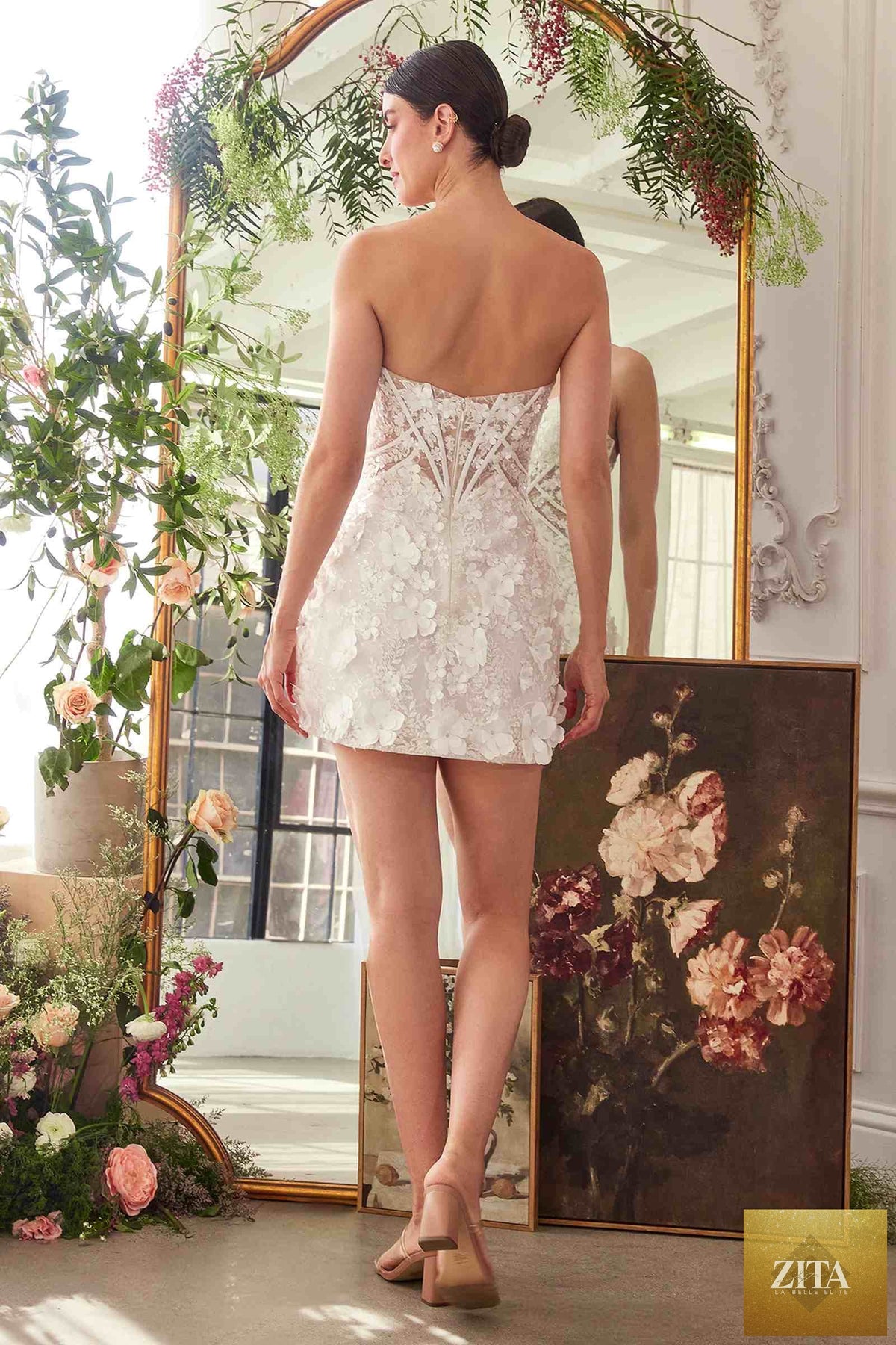 Off-white Andrea & Leo strapless deep sweetheart midi bridal dress with back view, featuring a fitted bodice and flowing skirt.