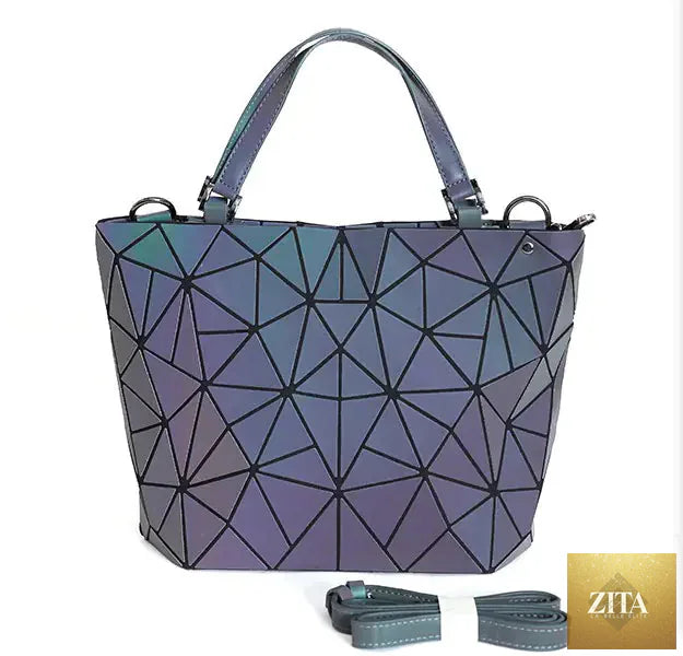 Geometric laser-cut women's handbag and crossbody bag in black with a sleek design and adjustable strap, Trendy Attic Store01.