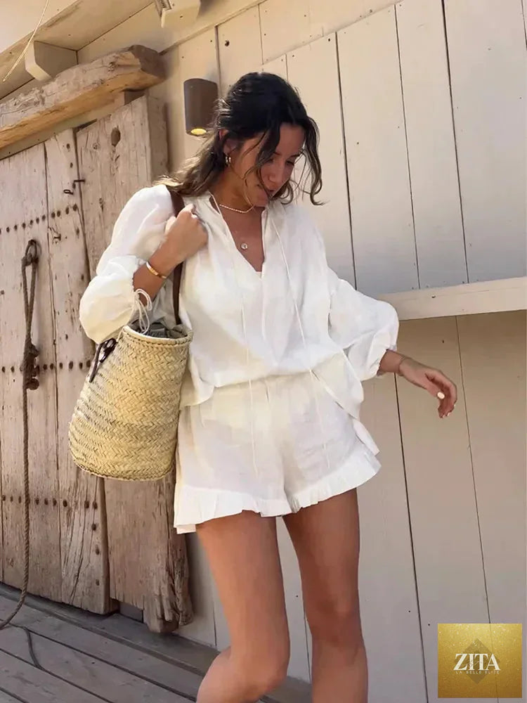 Women's solid cotton linen ruffle shorts suit with V-neck, long sleeves, drawstring waist, and loose fit, two-piece set.