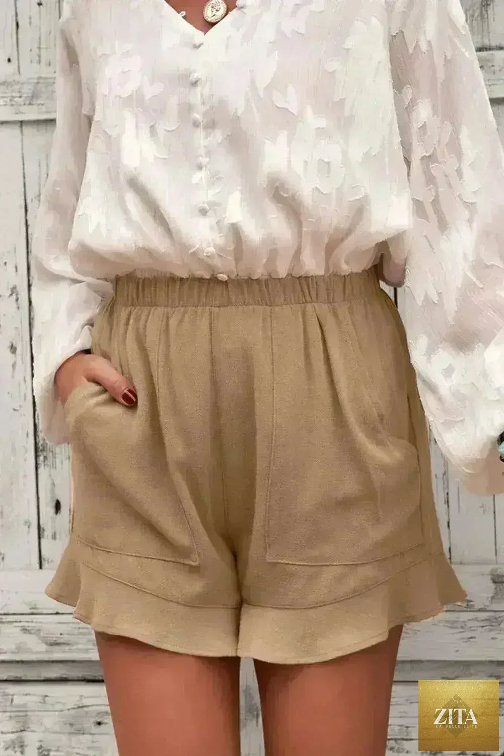 Women’s khaki flutter shorts by Femstylo featuring a linen style, with pockets and a relaxed summer cotton design.
