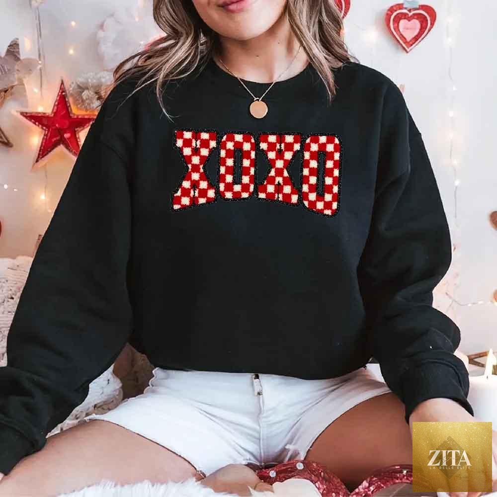 Furry checkered XOXO Valentine sweatshirt by Adorb Custom Tees with printed heart patterns and cozy fabric detail.