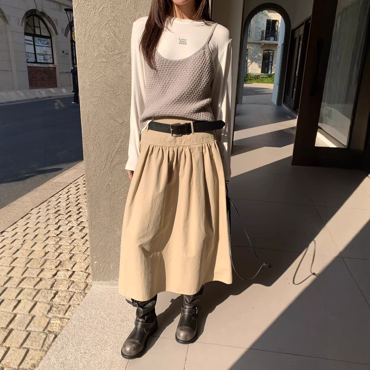 FitiqueFit relaxed A-line crushed pleat cotton midi skirt with belt, casualwear, shown hanging with pleated fabric and waist belt detail.