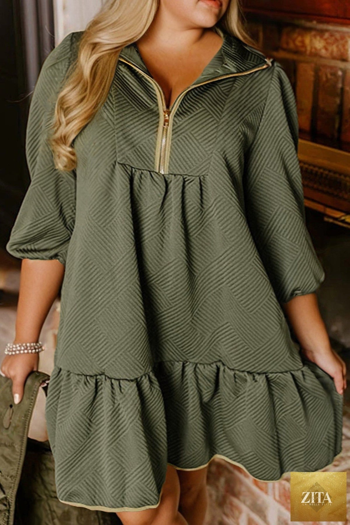 Jungle green plus size textured mini dress with contrast trim, quarter zip, bracelet sleeves, from Wild and Free Boutique.
