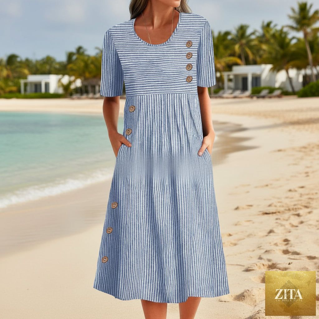 Zita La Belle Elite button-down swing maxi dress with short sleeves, pockets, and a relaxed pullover design in a flowing fabric.