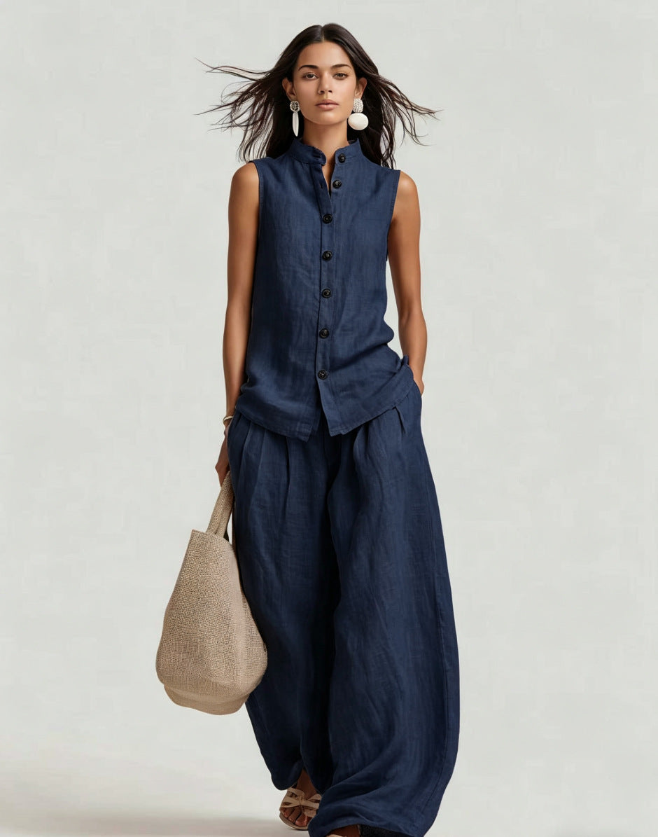 Women's casualwear set by FitiqueFit featuring a sleeveless stand collar top and high-waist wide-leg pants, styled for a relaxed look.