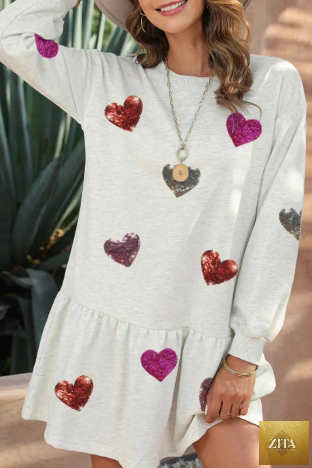 Sequin heart round neck long sleeve mini dress by Shopiebay featuring shimmering sequins and a fitted silhouette.