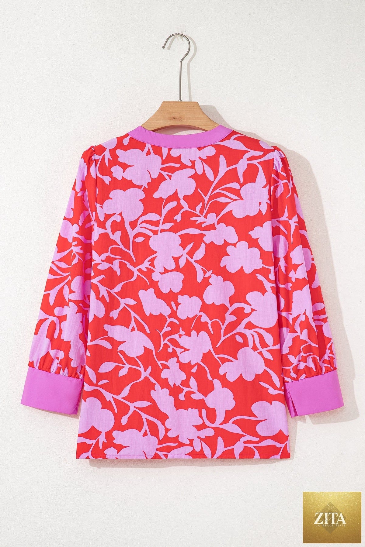 Red floral print split V-neck blouse with cuffed bracelet sleeves from Wild and Free Boutique, showing front view of the stylish top.