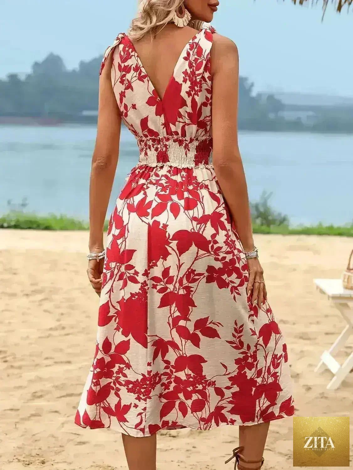 Women’s smocked surplice midi dress by Zita La Belle Elite, flowing viscose fabric, featuring a flattering V-neck and elegant design.