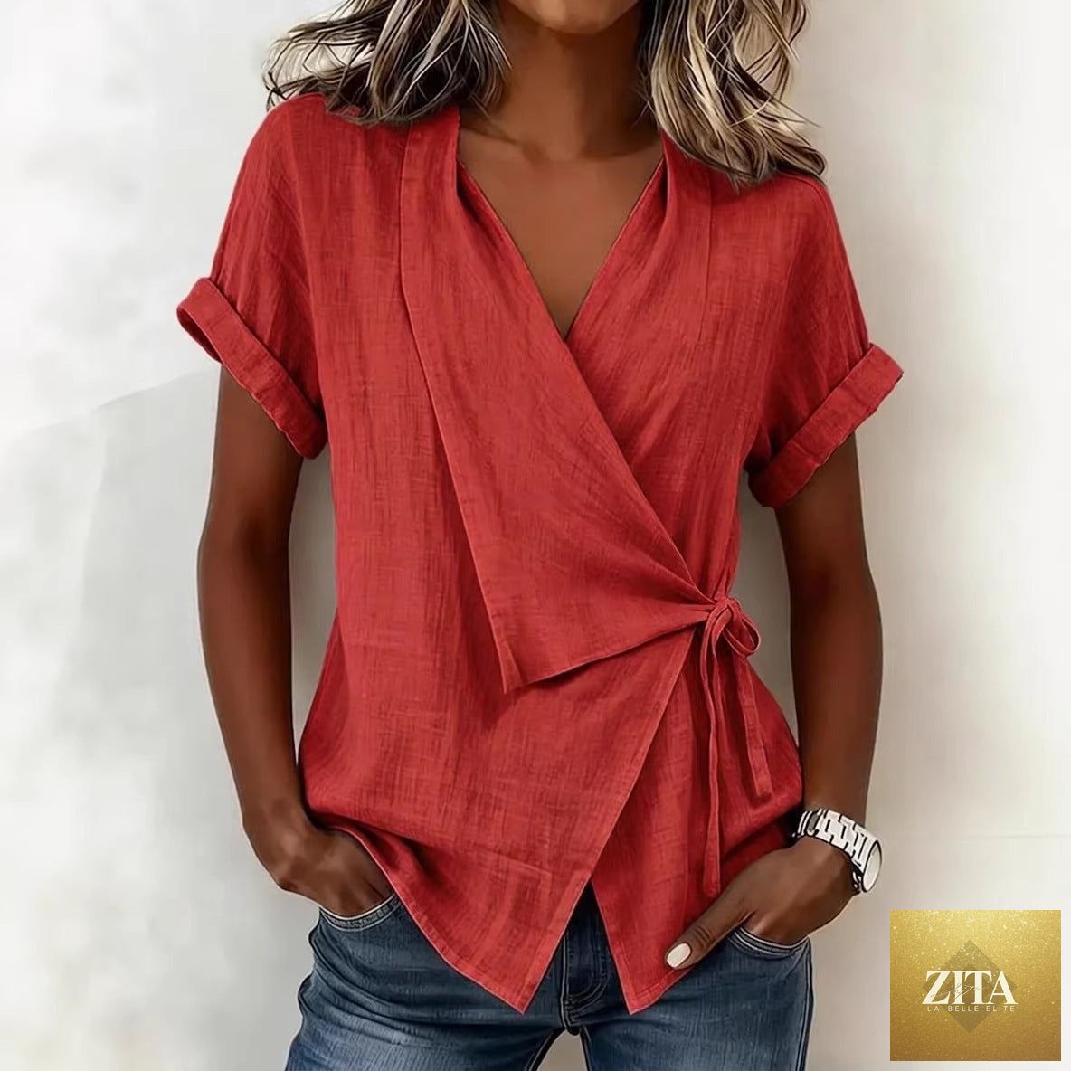 Women's casual linen top with lapel collar and lace-up short sleeves from Zita La Belle Elite, displayed on a hanger.