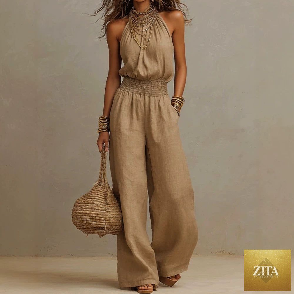 Women’s FitiqueFit halter-neck backless wide-leg jumpsuit in solid color, stylish streetwear with flowing wide-leg design.
