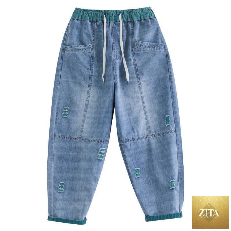 Women's ripped Ninth jeans by FitiqueFit, showcasing distressed denim style and slim fit design.