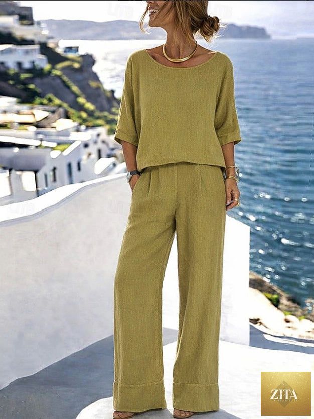 Women's cotton linen resort set by Zita La Belle Elite featuring a short sleeve top and wide-leg pants, shown on a model.