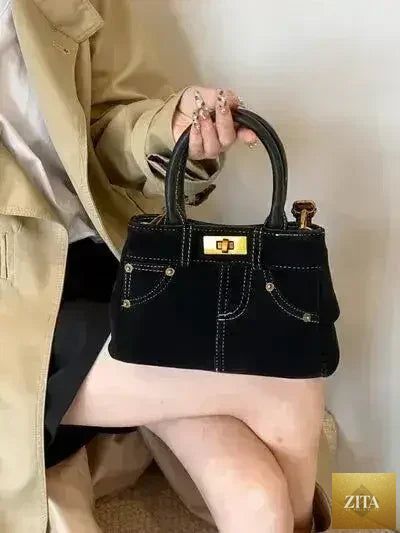 Femstylo stylish suede handbag with adjustable strap and dual-use design, featuring a sleek, modern look and spacious interior.