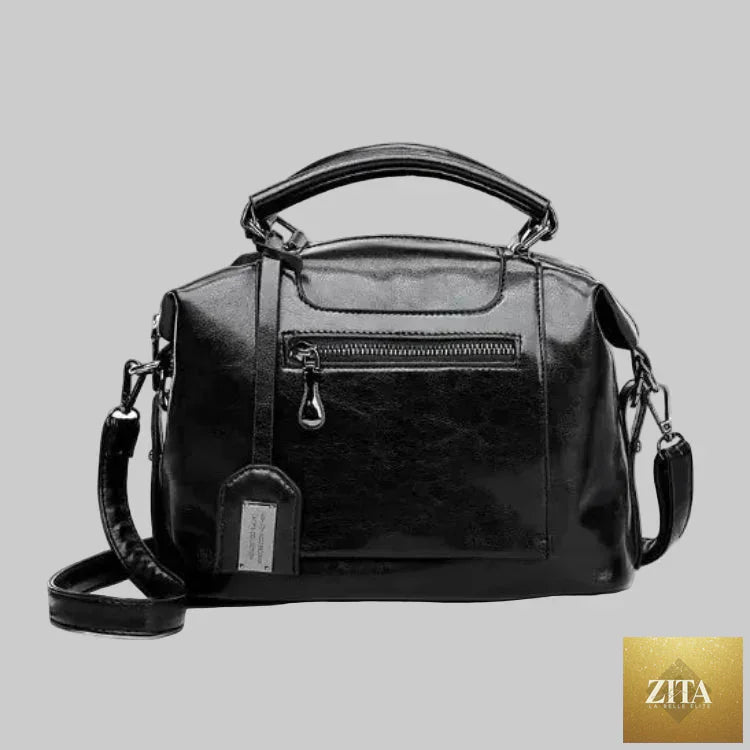 Leather women's handbag featuring a soft tote and crossbody style, with sleek design and adjustable strap from Trendy Attic Store01.