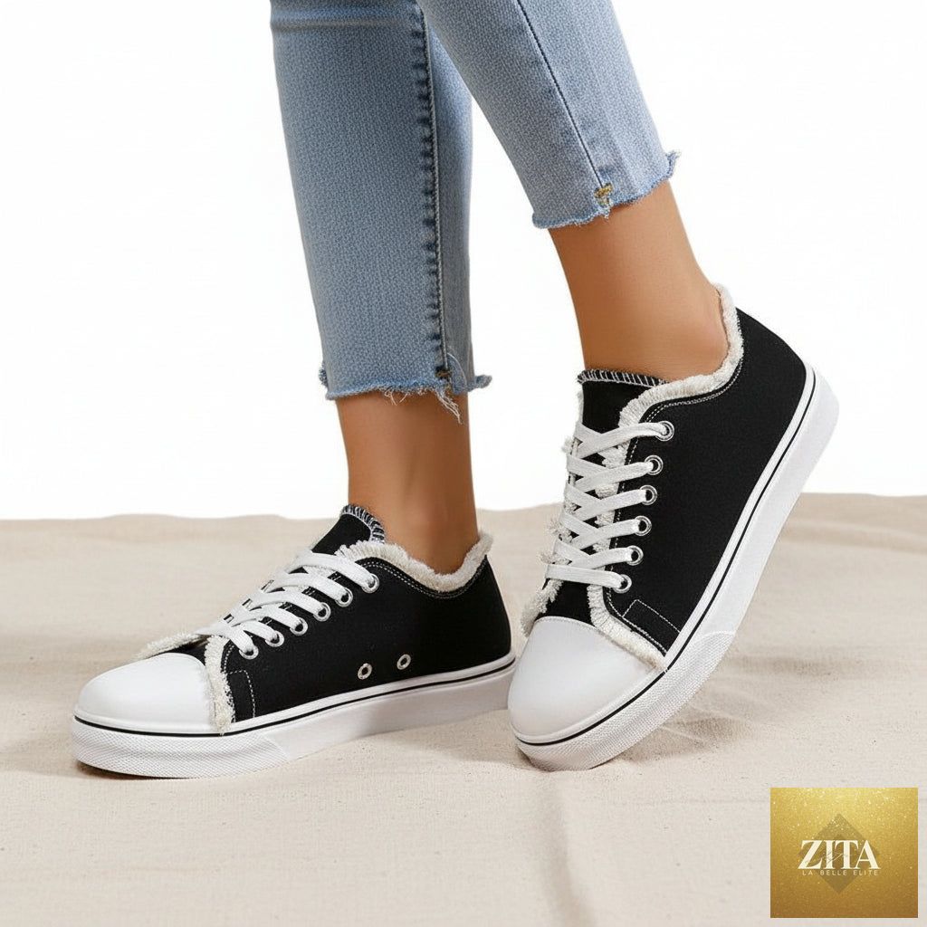 Women's lightweight FitiqueFit lace-up canvas sneakers with flat low-top design and white rubber soles.