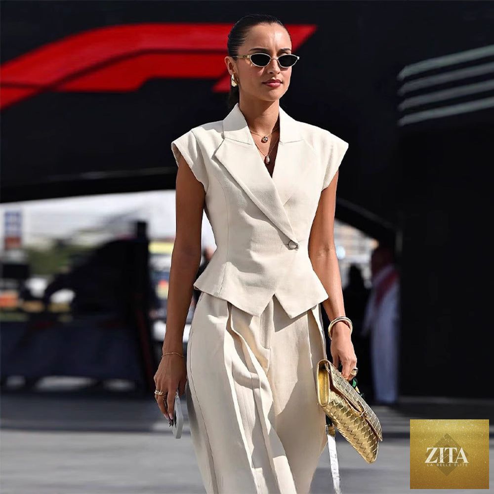 Women’s elegant sleeveless two-piece suit set by Zita La Belle Elite, featuring a waist-cinching design and stylish, sleeveless top.