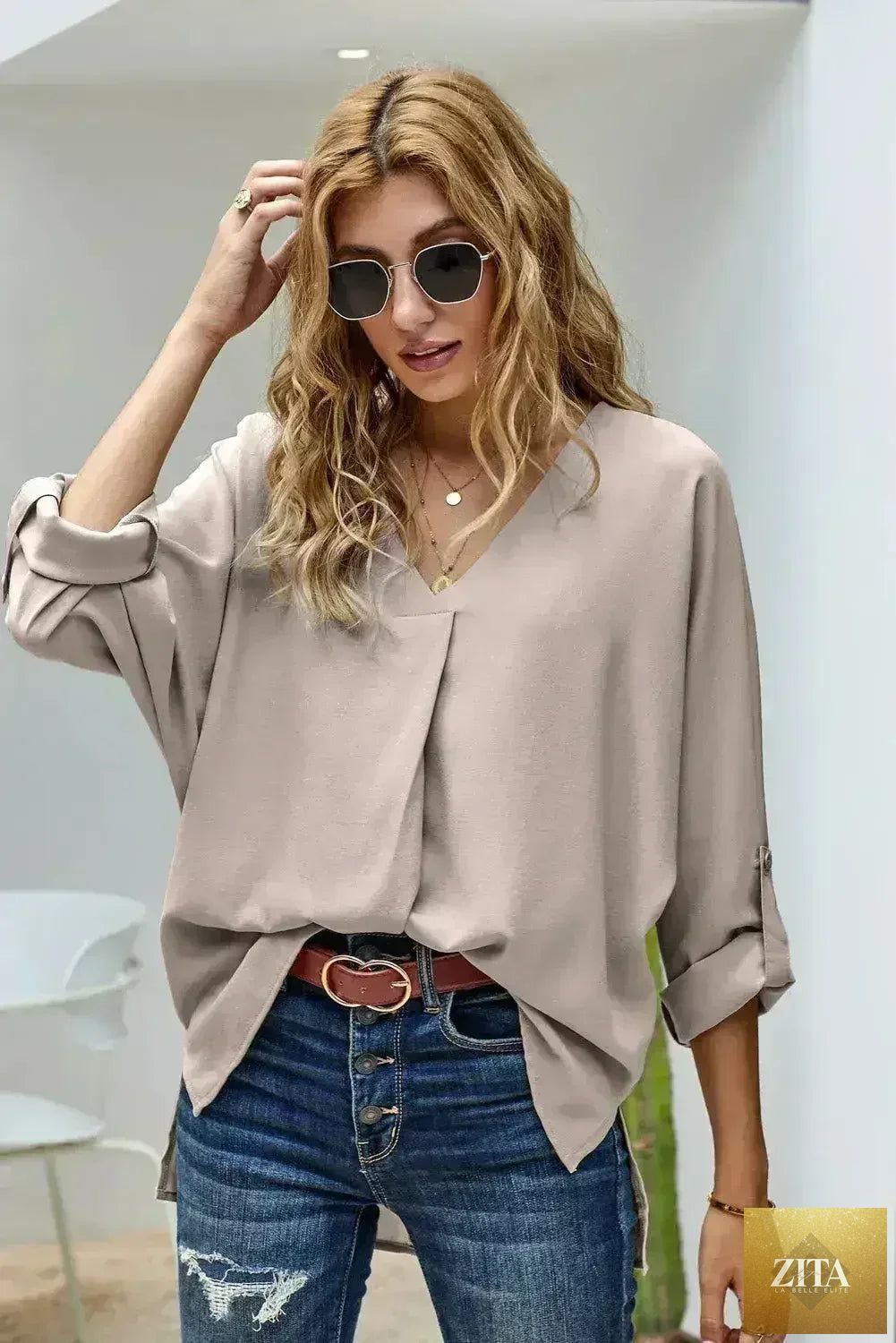 Elegant apricot V-neck blouse with 3/4 sleeves and high-low hem, stylish Femstylo tops and blouses.