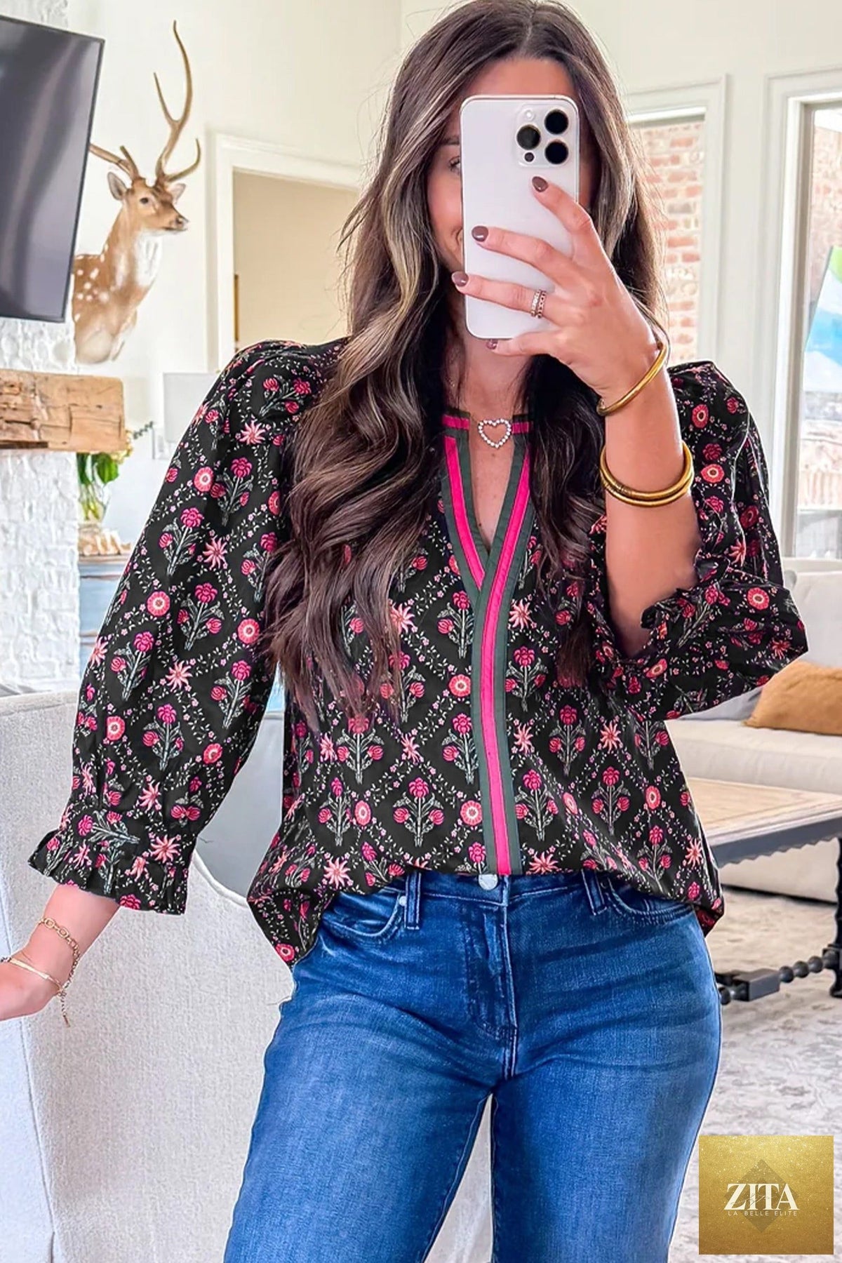 Black vintage floral blouse with contrast V-neckline, bracelet sleeves, and a feminine, stylish design from Wild and Free Boutique.