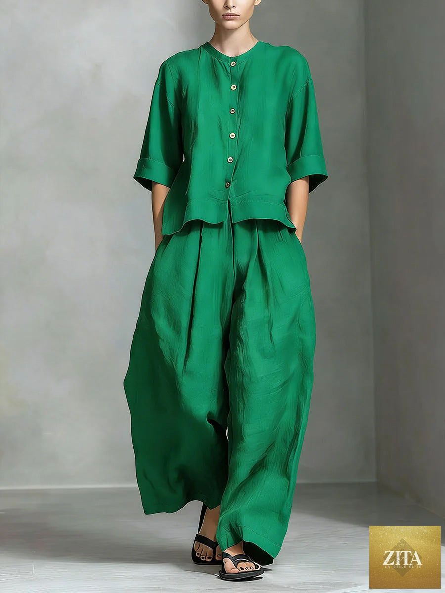 Two-piece set featuring a three-quarter sleeve shirt and loose trousers by FitiqueFit, shown in a casual, stylish outfit.