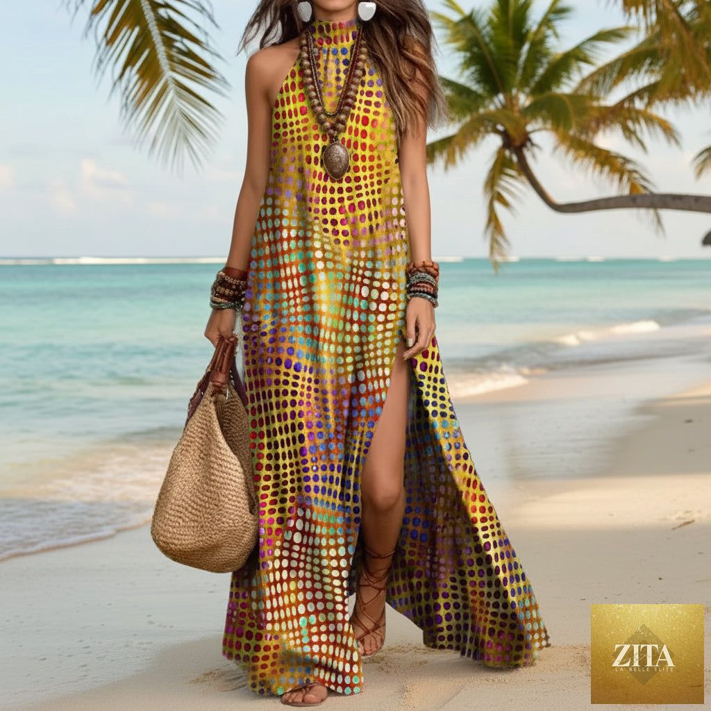 Women's printed halterneck split maxi dress by Zita La Belle Elite, sleeveless and loose fit, flowing fabric, vibrant floral pattern.
