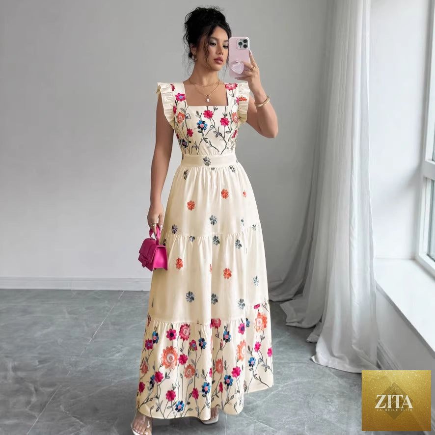 Women’s floral print waist-cinching puff sleeve dress by FitiqueFit, featuring a feminine silhouette and vibrant floral pattern.